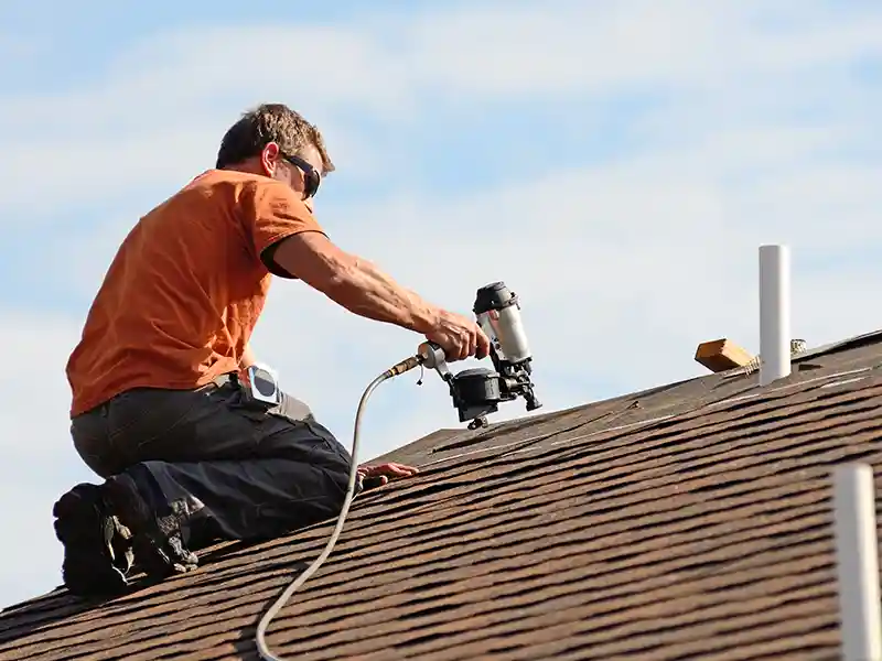 contractor reparing roof image