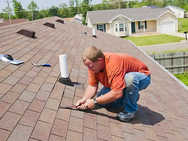 contractor inspecting roof damage image