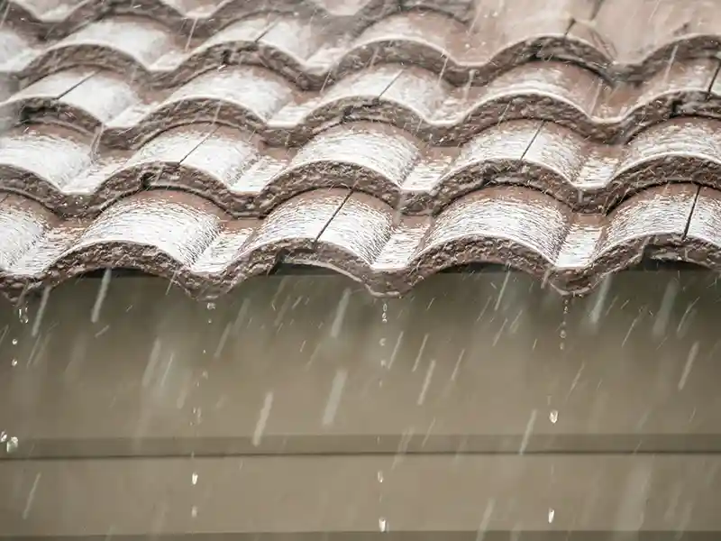 rain falling down from a house roof image